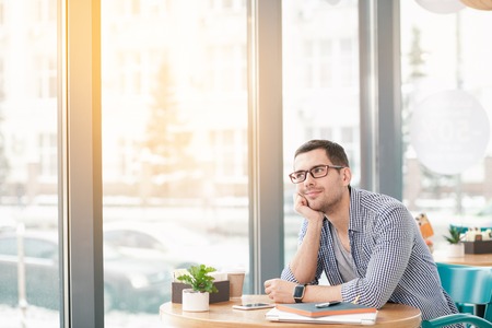 Young stylish man in cafeの写真素材