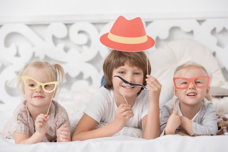 Little Children Playing Together at Home Conceptの写真素材