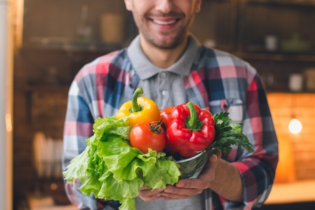 Young Man Vegan Healthy Food Meal Preparationの写真素材