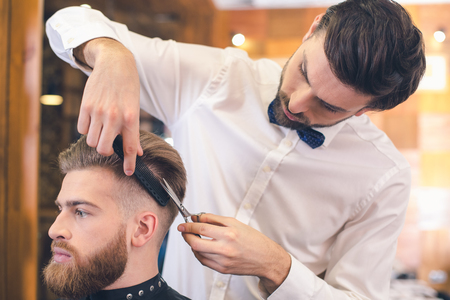 Young Man in Barber Shop Hair Care Service Conceptの写真素材