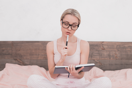 Young Woman Taking Notes Conceptの写真素材