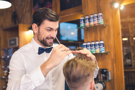 Young Man in Barber Shop Hair Care Service Conceptの写真素材