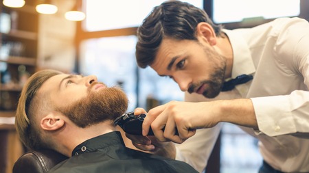 Young Man in Barbershop Hair Care Service Conceptの写真素材