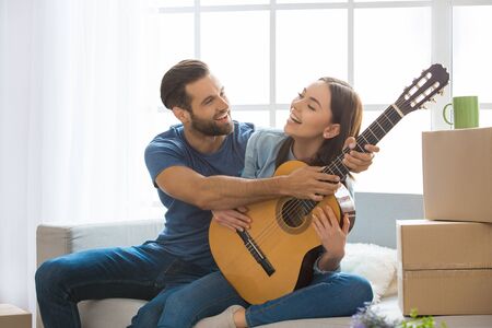 Young couple moving to a new apartment together relocationの写真素材