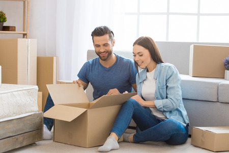 Young couple moving to a new apartment together relocation