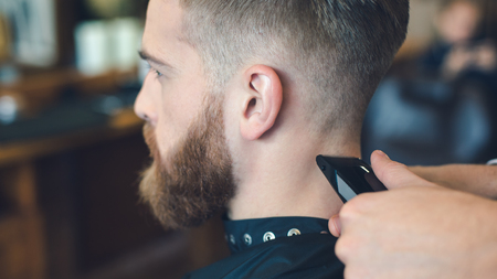 Young Man in Barbershop Hair Care Service Conceptの写真素材