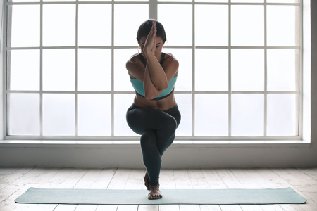 Young Woman Doing Yoga Pose Exercise Healthy Lifestyleの写真素材