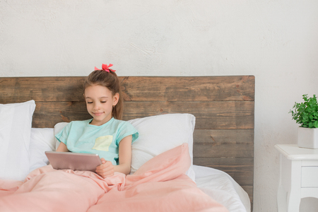 Young teenager girl alone at home childhoodの写真素材