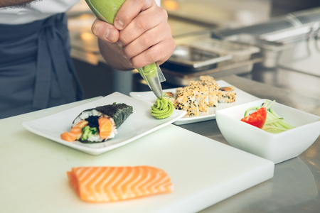 Man japanese restaurant chef cooking in the kitchenの写真素材