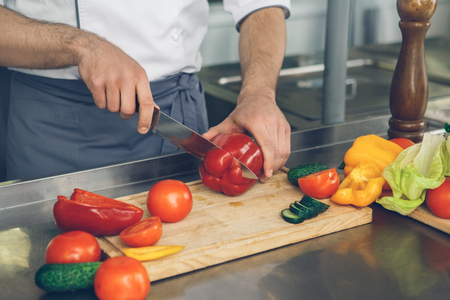 Man japanese restaurant chef cooking in the kitchenの写真素材