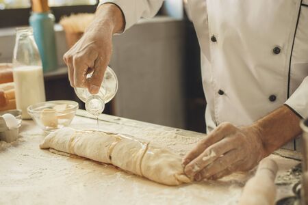 Bakery chef cooking bake in the kitchen professionalの写真素材