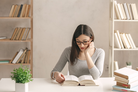 Young woman study at home alone educationの写真素材