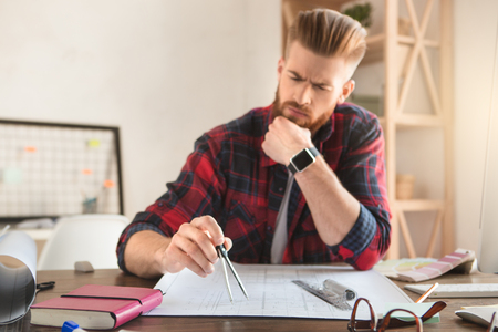 Young man architect working in the office ocuupationの写真素材