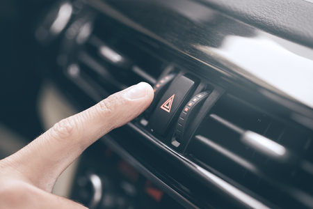 Young business person test drive new vehicle push buttonの写真素材