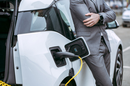 Man transportation by modern eco car charge energyの写真素材