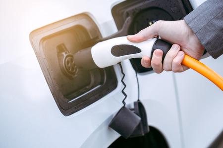 Man transportation by modern eco car charge energyの写真素材