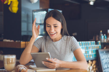 Young woman sitting in a coffee shop leisureの写真素材