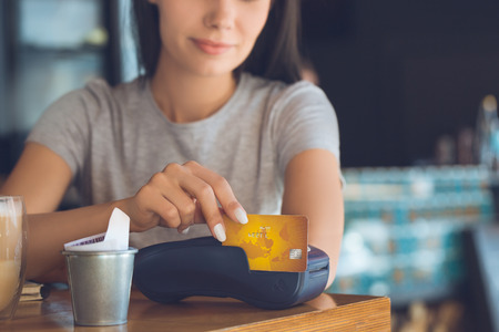 Young woman sitting in a coffee shop leisureの写真素材