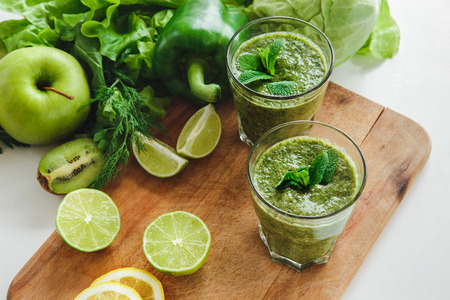 Detox smoothie fresh ingredients isolated on tableの写真素材