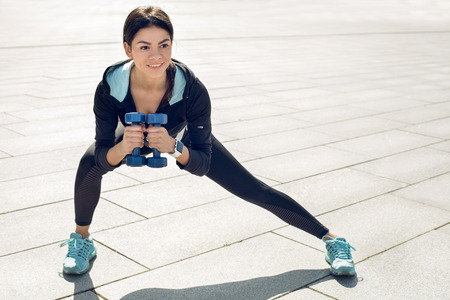 Young woman active exercise workout on street outdoorの写真素材