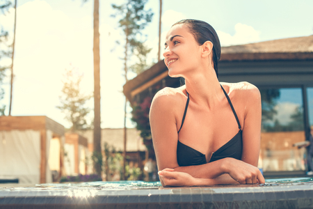 Young woman in the swimming pool restの写真素材