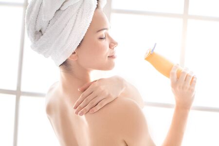 Young woman body care at home indoorsの写真素材