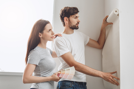 Young couple doing apartment repair together themselvesの写真素材