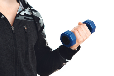 Male training in gym body workout with dumbbellsの写真素材