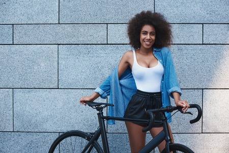 Young woman in jeans jacket free style on the street isolated onの写真素材