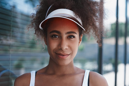 Young woman in visor free style on the street walking near windoの写真素材