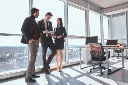 Businesspeople at office working together standing man browsing