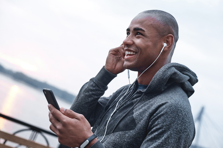 Young male jogger athlete training and doing workout outdoors inの写真素材