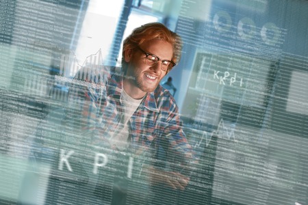 Cropped shot of a happy computer developer writing code in glasses