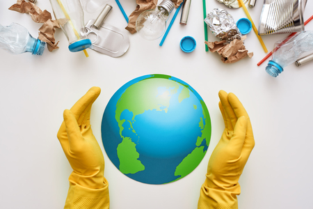 Protect the worlds ecology. Different types of garbage attacked the globeの販売画像