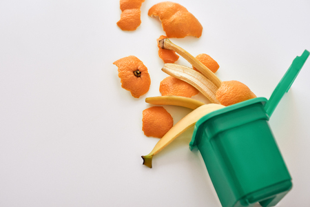 Cropped photo of organic garbage. Banana and orange peels, isolatedの写真素材