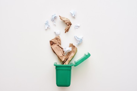 Paper trash. Crumple paper falling to the recycling binの写真素材