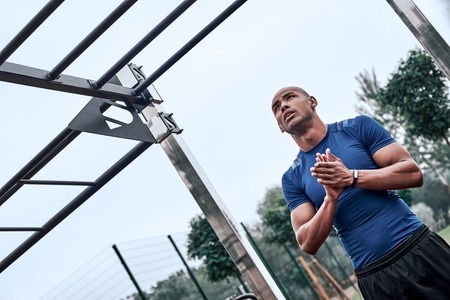 An african man is exercising at open air gymの写真素材