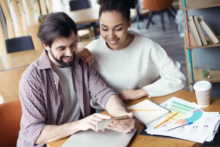 Young people coworking together at creative office sitting guy sの写真素材