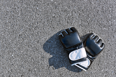 Sports boxing gloves at the asphalt backgroundの写真素材