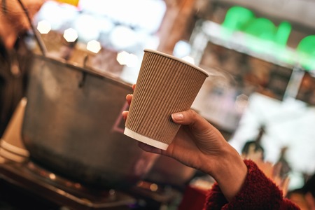 Close-up of mulled wine at the street food market.の写真素材