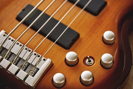 Parts of Electric guitar. Close up view of electric guitar body with volume and tone control knobsの写真素材