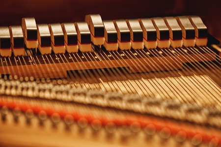 Inside of a piano. Close-up view of hammers and strings inside the piano. Musical instrumentsの写真素材