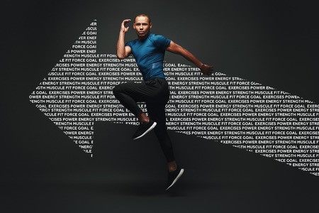 Pushing hard to win. Sportsman jumping over dark background. Graphic drawing.の写真素材