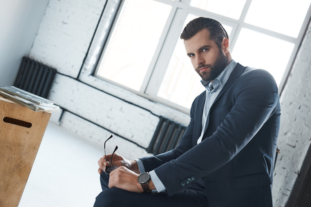 Bearded man with a very interesting lookの写真素材
