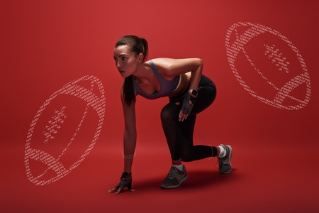 Young, attractive sportswoman standing in the position for a run, isolated over red background. Graphic drawingの写真素材