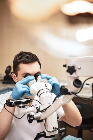 Upscale dental care. Professional modern microscope equipment at dental office in use. Stomatology...
