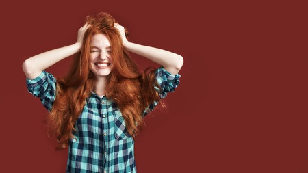 Happiness is my choice Modern playful teenage girl touching her hair