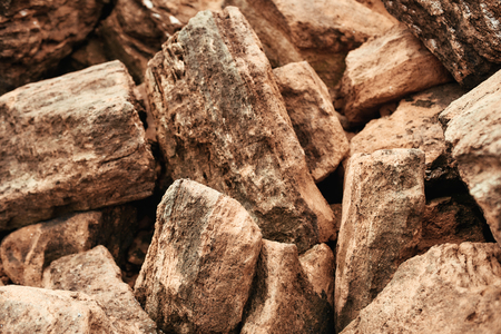 Close up of big brown stones. Group of granite rock stones. Mountain texture and background. Nature concept.の写真素材