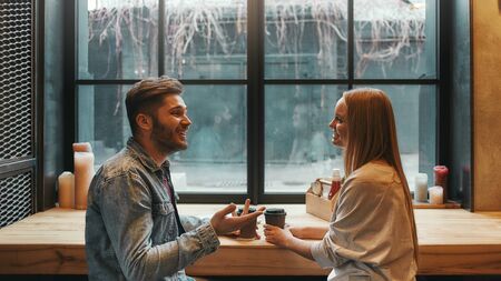 Romantic atmoshere. Man and woman have a meeting in a modern cafeの写真素材