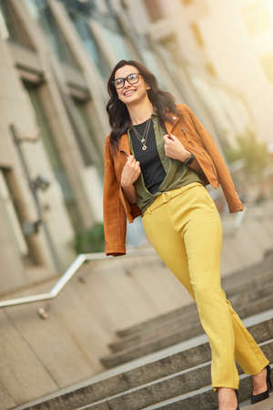 Enjoying nice day outdoors. Full length of a young beautiful and stylish caucasian woman or business...
